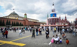 People walk on Red Square in downtown Moscow